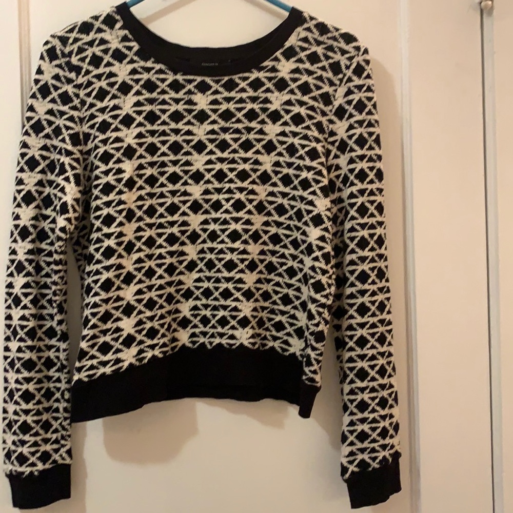 white and black sweater